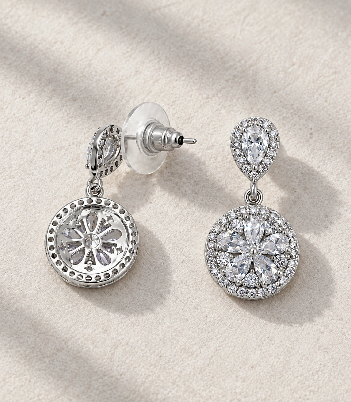 JIMIKI Silver-Tone Pear and Round Cluster Drop Earrings in Silver-tone, editorial flat lay