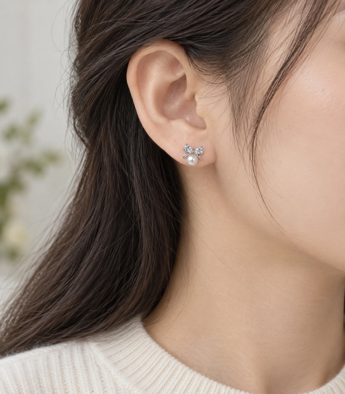 JIMIKI Silver-Tone Pearl Crystal Bow Stud Earrings in Silver / White, model wearing view