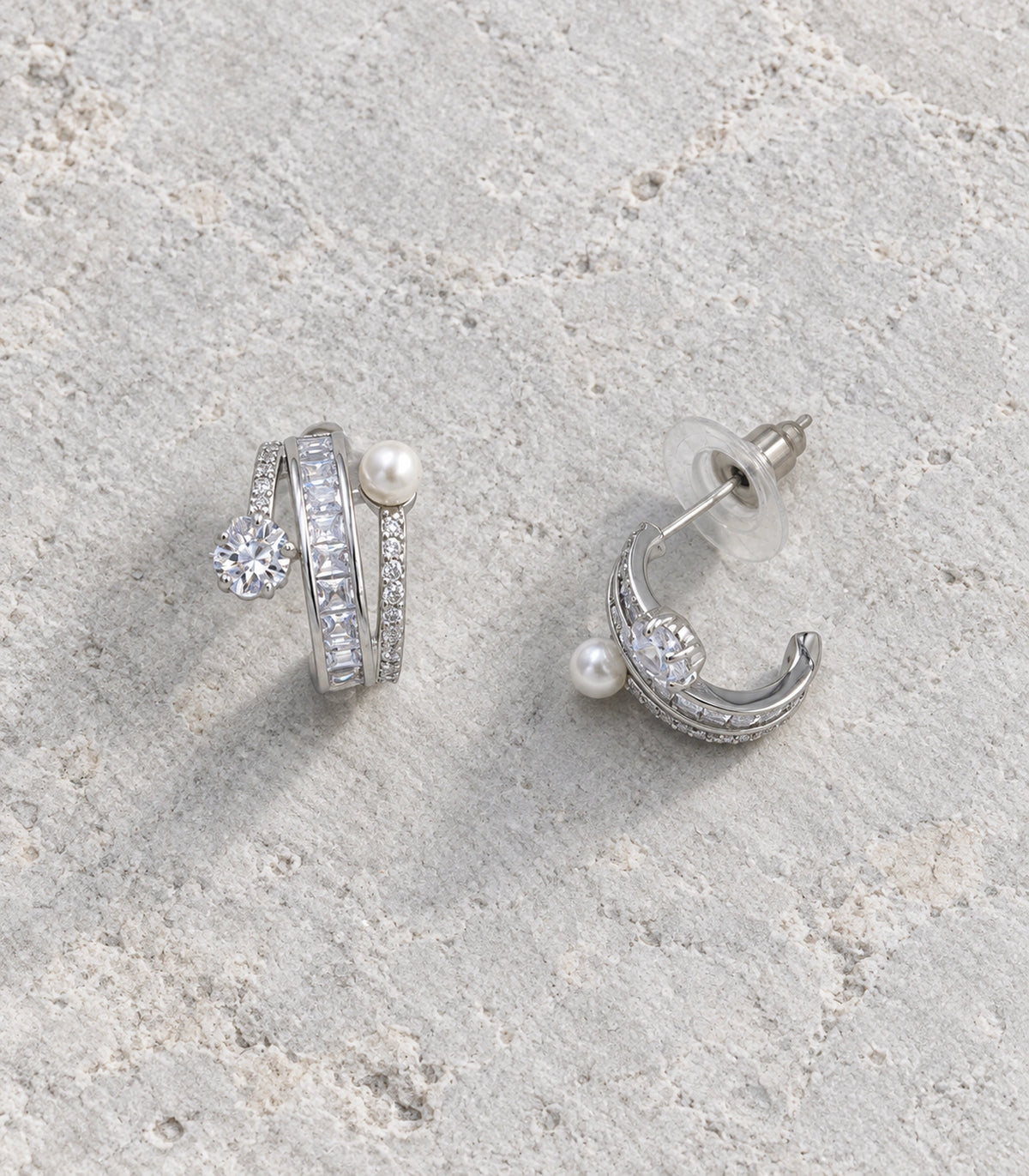 JIMIKI Silver-Tone Pearl Crystal Multi-Row Hoop Earrings in Silver / Clear / White, editorial flat lay
