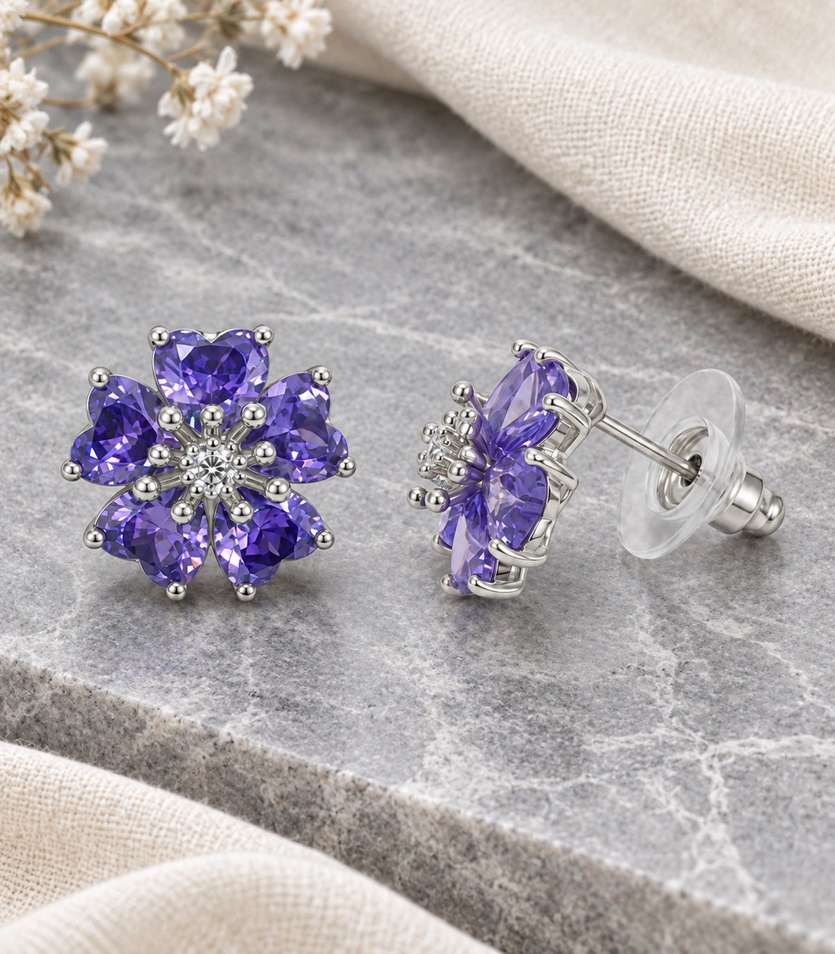 JIMIKI Five Petal Crystal Flower Stud Earring Pair in Silver tone / purple, editorial flat lay #color_silver tone / purple