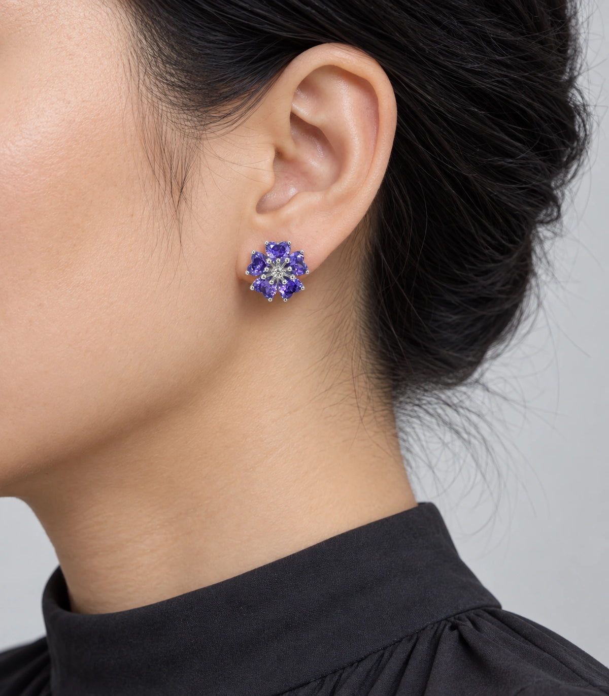JIMIKI Five Petal Crystal Flower Stud Earring Pair in Silver tone / purple, model wearing view #color_silver tone / purple