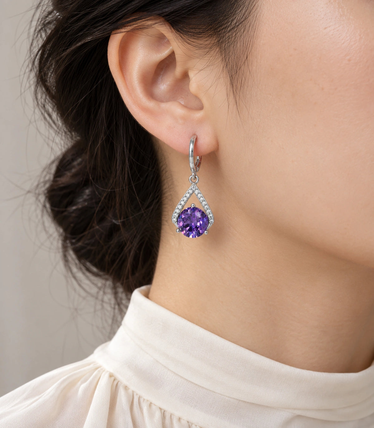 JIMIKI Round Crystal Teardrop Frame Drop Earring Pair in Silver tone/Purple, model wearing view #color_silver tone/purple