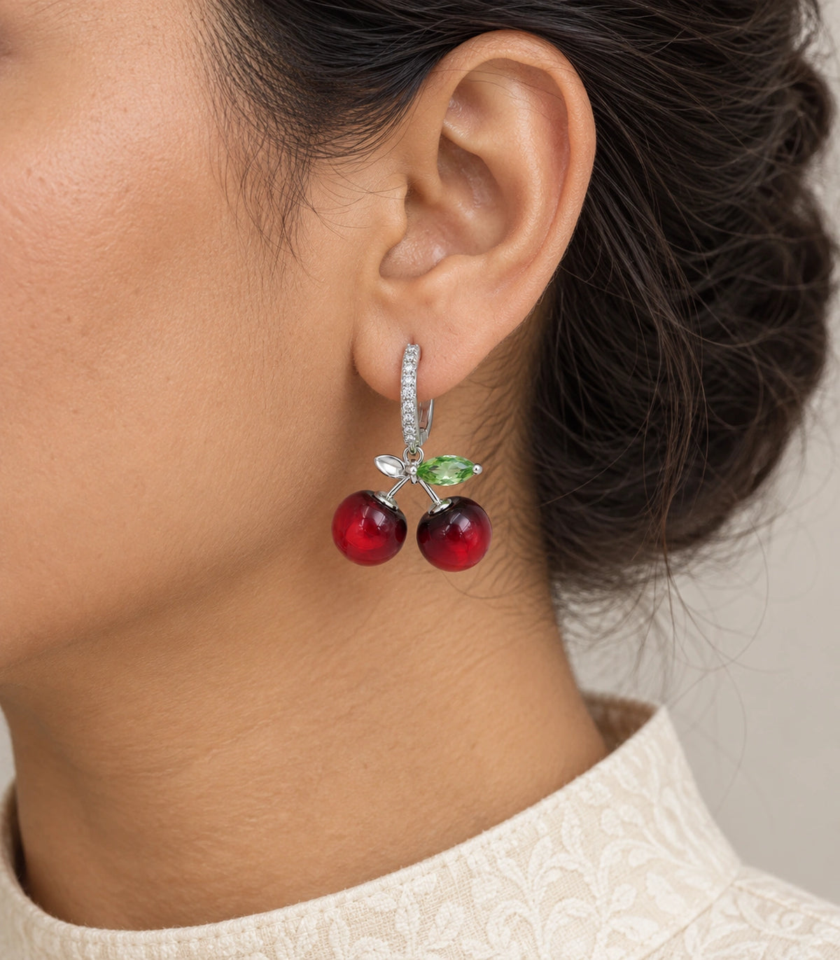 JIMIKI Cherry Crystal Leaf Hoop Earring Pair in Silver-tone / Red / Green, model wearing view #color_silver-tone / red / green