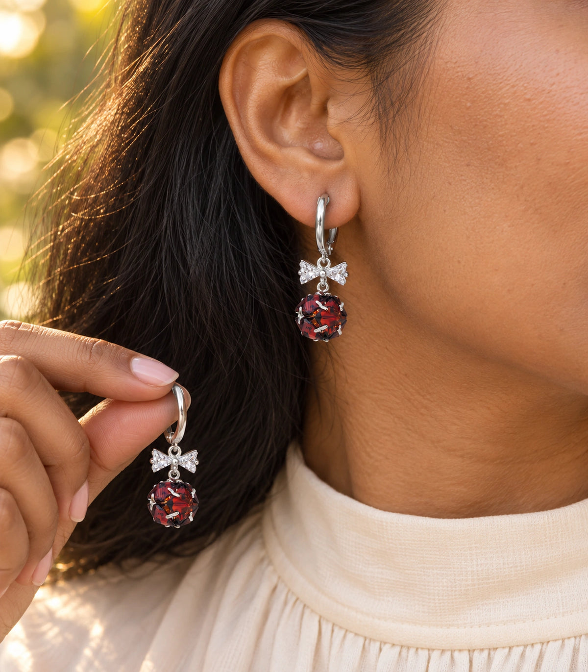 JIMIKI Silver Tone Red Crystal Ball Bow Drop Hoop Earring Pair in Silver-tone / Red, editorial model view