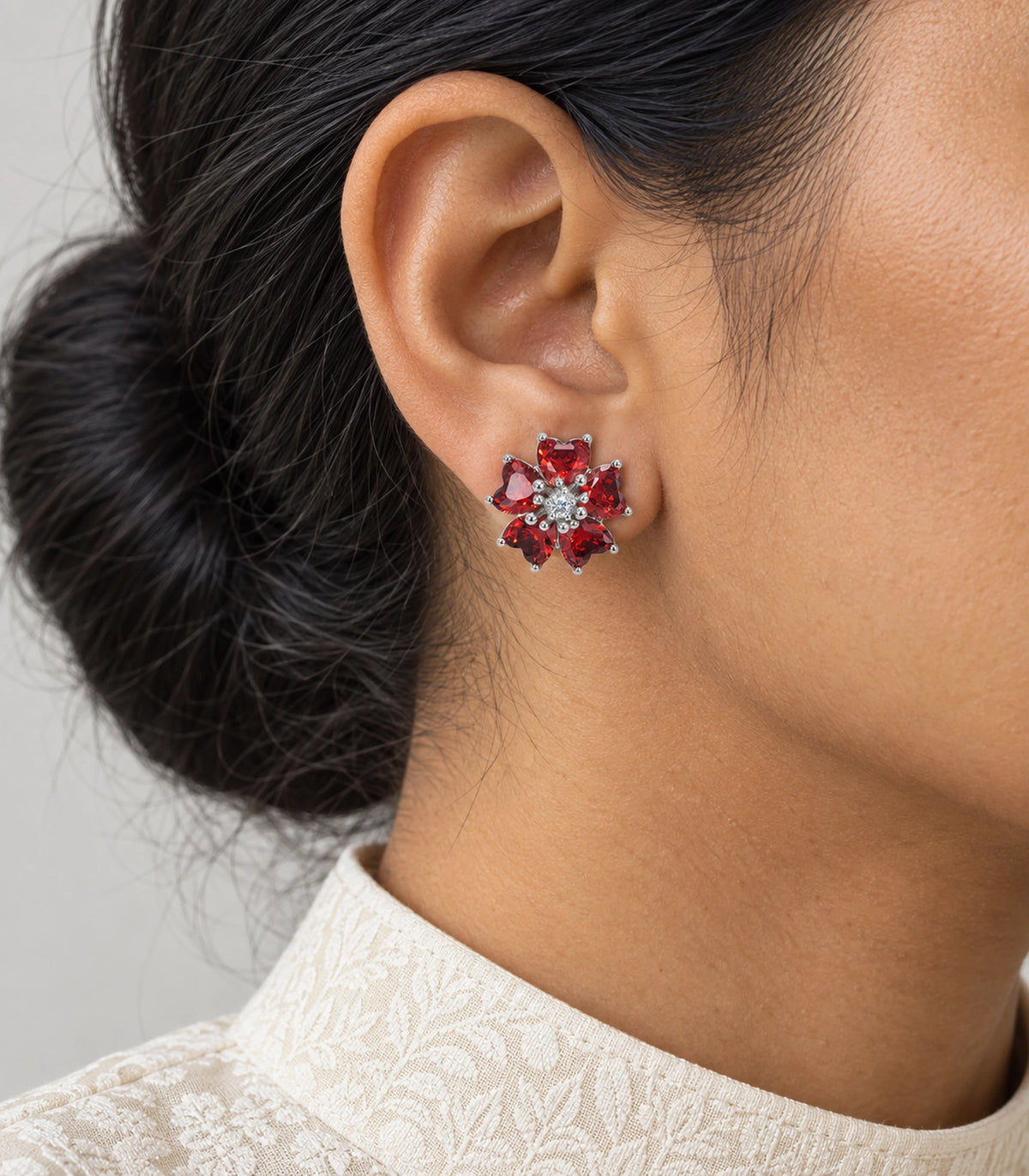 JIMIKI Five Petal Crystal Flower Stud Earring Pair in Silver tone / red, model wearing view #color_silver tone / red