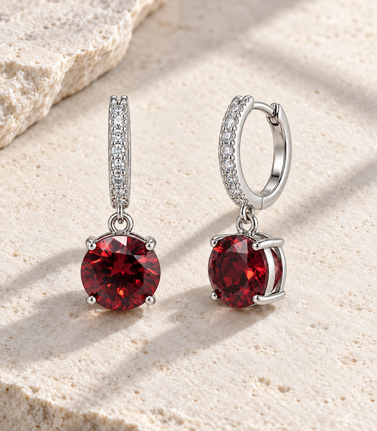 JIMIKI Round Crystal Hoop Drop Earring Pair in Silver tone / red, editorial flat lay #color_silver tone / red