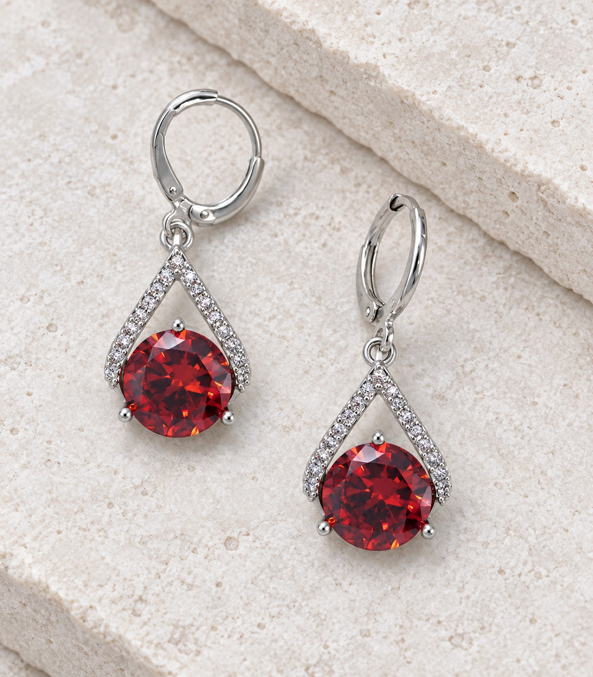 JIMIKI Round Crystal Teardrop Frame Drop Earring Pair in Silver tone/Red, editorial flat lay #color_silver tone/red