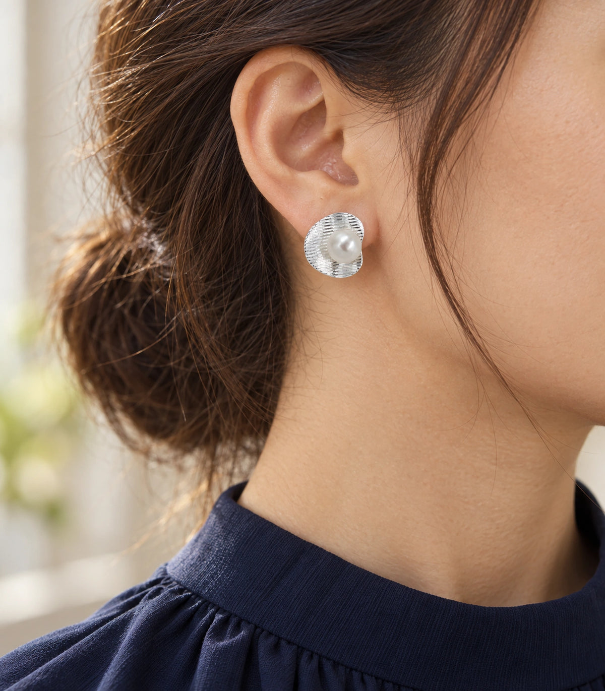 JIMIKI Ribbed Curved Disc Pearl Stud Earring Pair in Silver tone / White, editorial model view #color_silver tone / white