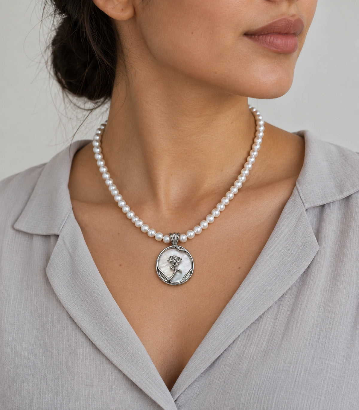 JIMIKI Silver Tone Rose Medallion Pearl Style Necklace in Silver tone / white, editorial model view