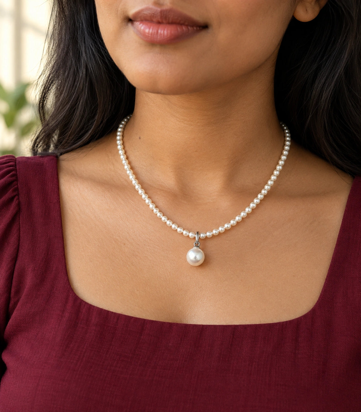JIMIKI Silver Tone Round Pearl Drop Beaded Necklace in Silver tone / white, editorial model view