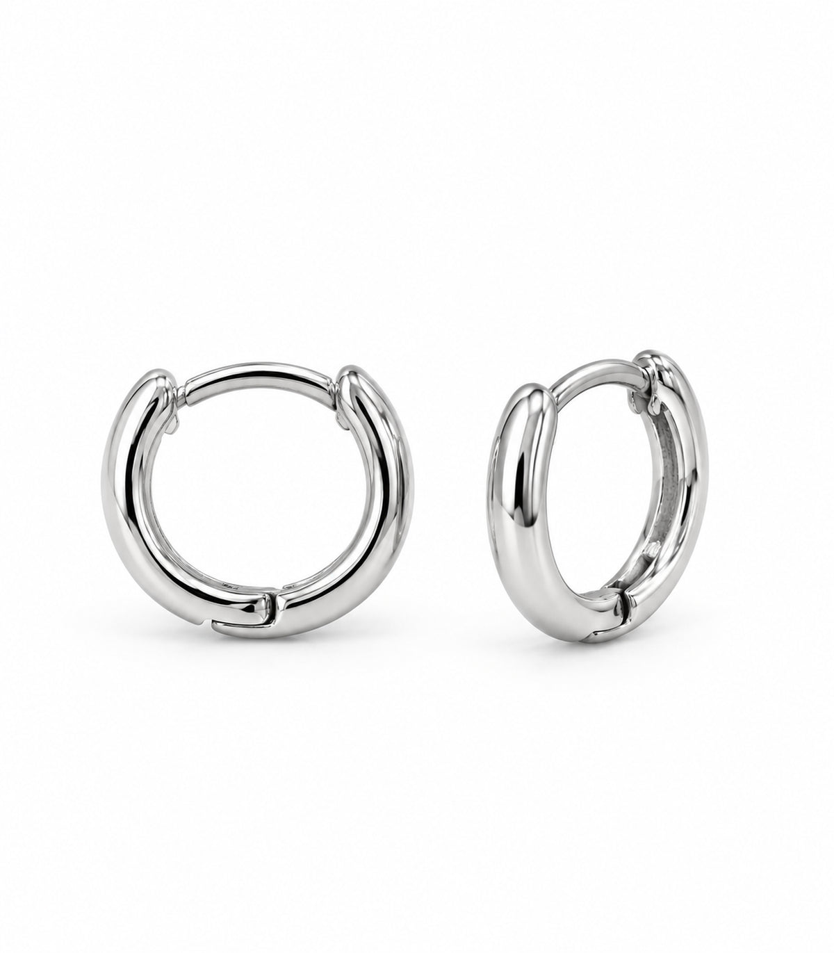 Silver Tone Smooth Huggie Hoop Earrings — complete pair on white background