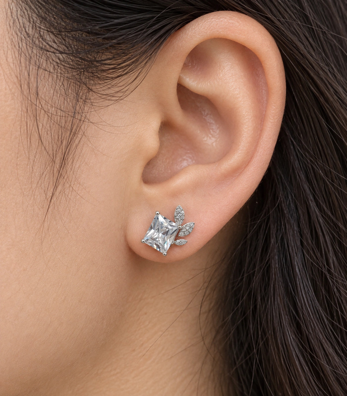 JIMIKI Silver-Tone Square Crystal Three-Leaf Stud Earrings in Silver / Clear, close-up detail