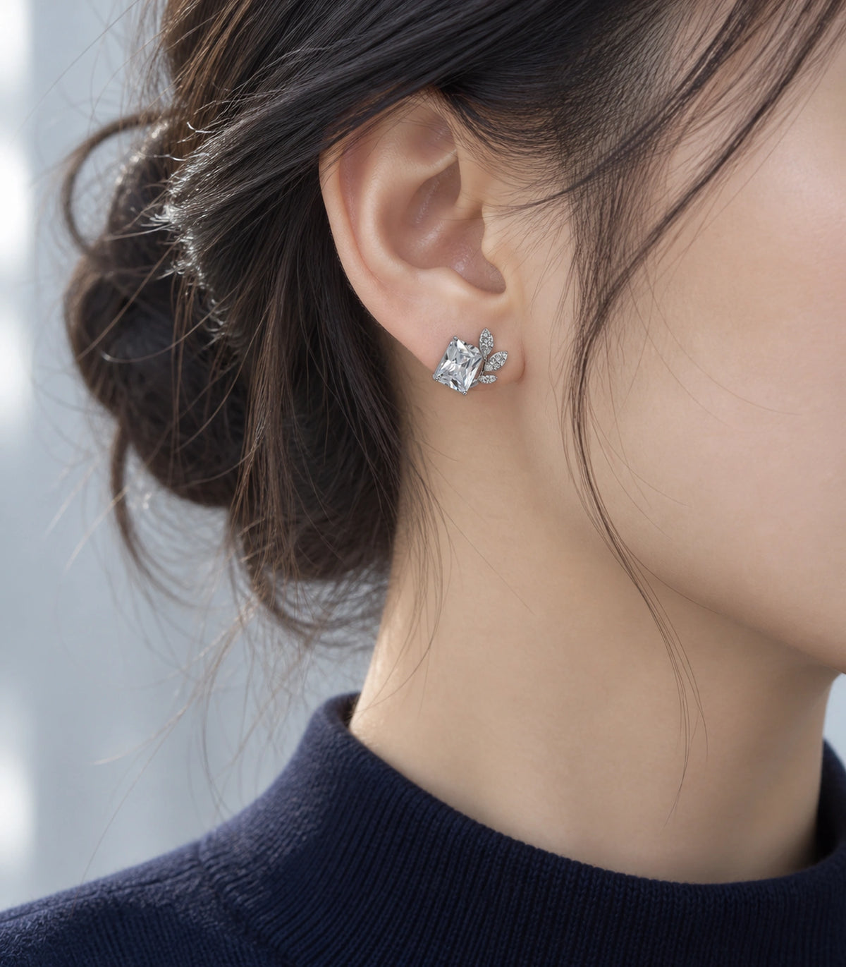 JIMIKI Silver-Tone Square Crystal Three-Leaf Stud Earrings in Silver / Clear, editorial model view