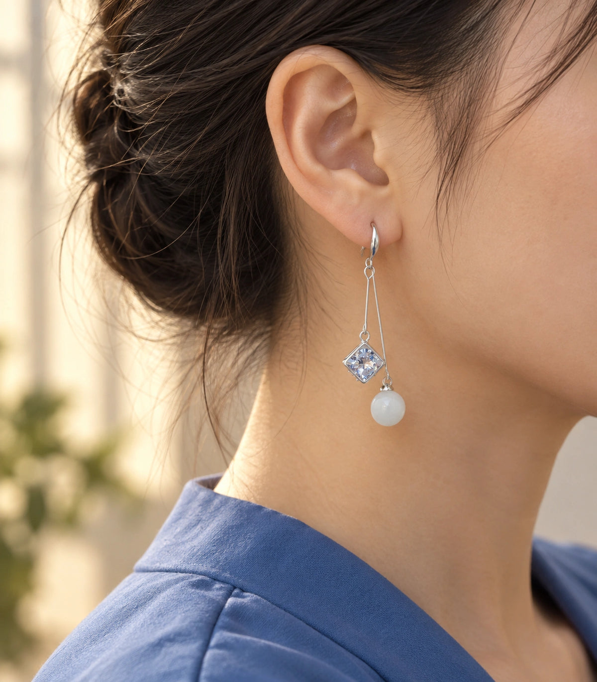 JIMIKI Silver Tone Square Crystal White Bead Wire Drop Earring Pair in Silver-tone, editorial model view