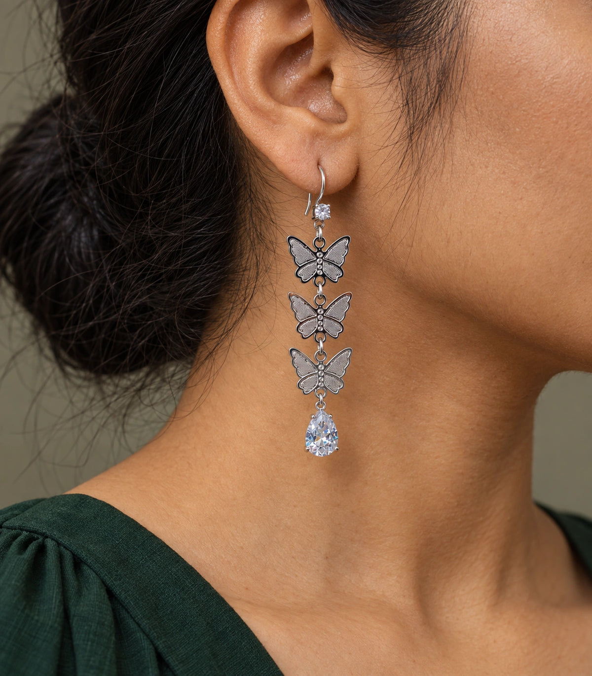JIMIKI Silver Tone Three Butterfly Pear Drop Earring Pair in Silver-tone, model wearing view