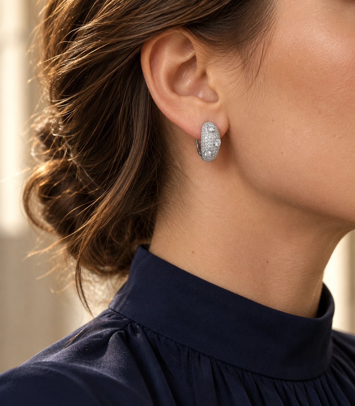 JIMIKI Three Crystal Domed Pave Hoop Earring Pair in Silver Tone, editorial model view #color_silver tone