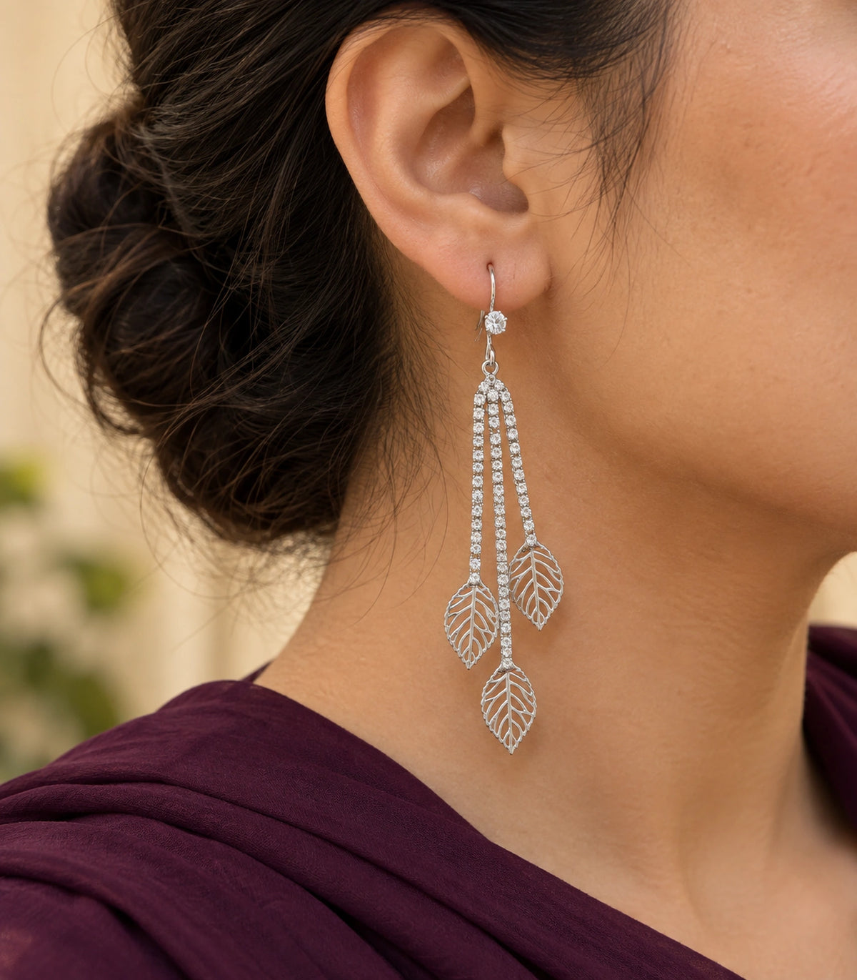 JIMIKI Silver Tone Three Leaf Crystal Tassel Earring Pair in Silver-tone, editorial model view