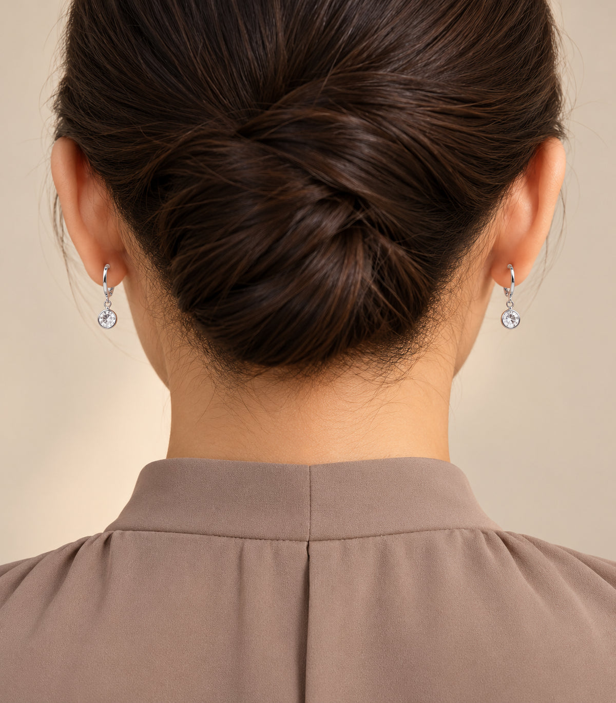 Silver-tone hoop earrings from the three-pair set in editorial styling