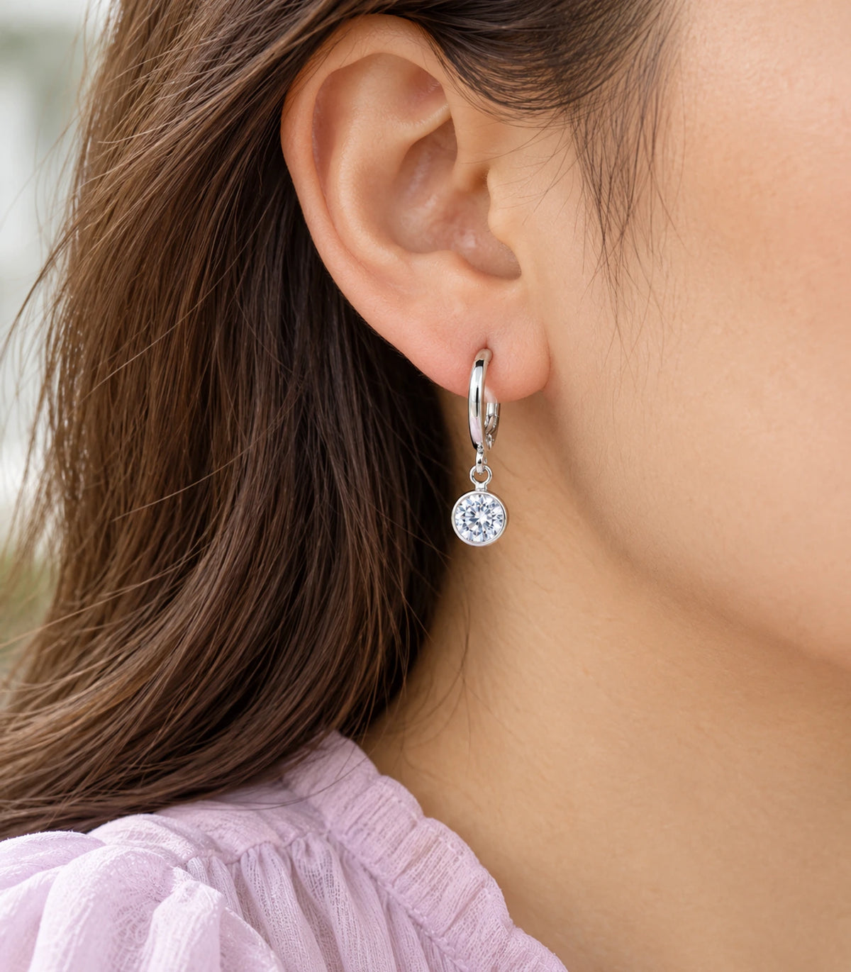 Silver Tone Three-Pair Crystal Butterfly Charm Hoop Earring Set — closeup showing one design from the set