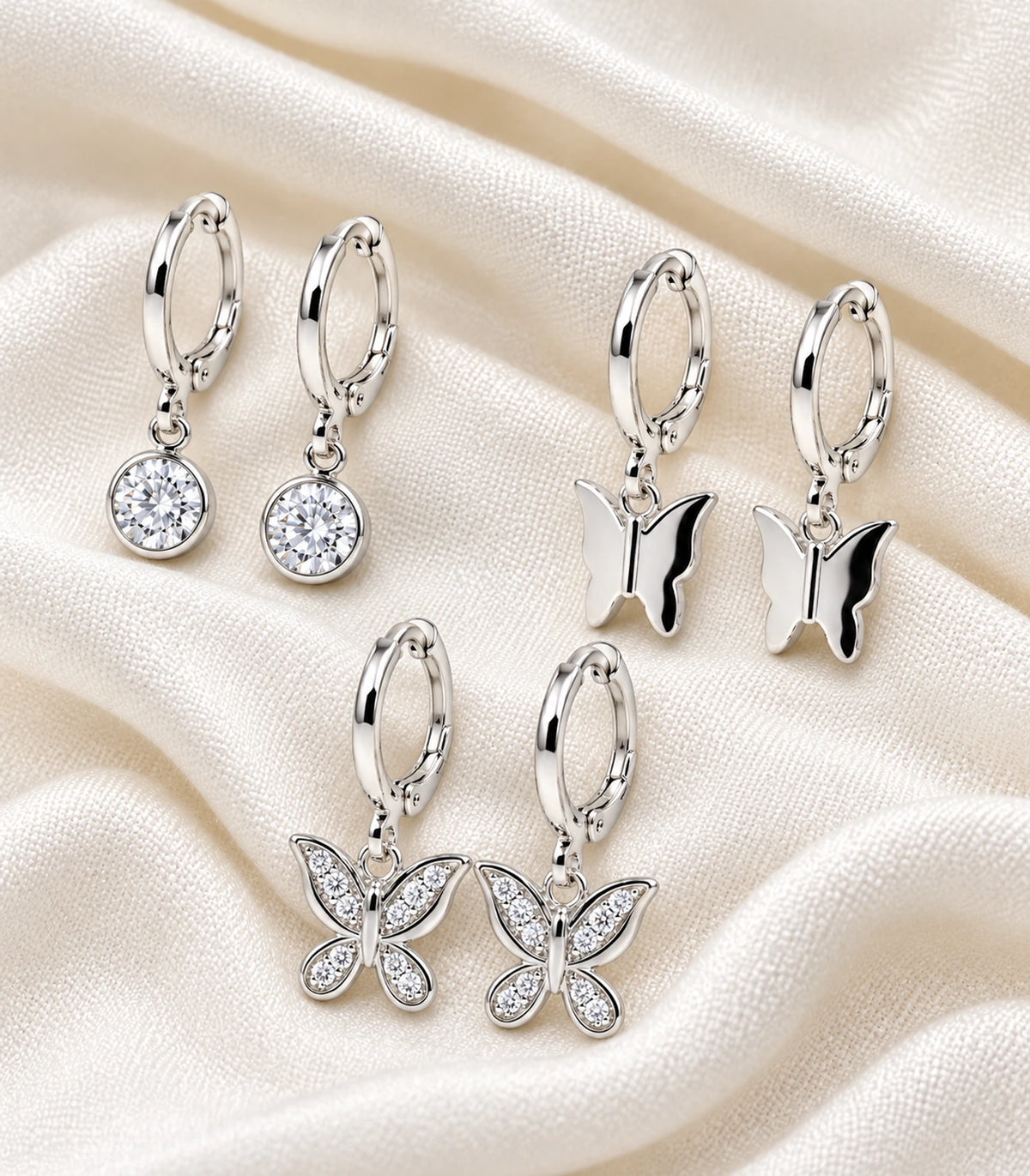 Silver Tone Three-Pair Crystal Butterfly Charm Hoop Earring Set — complete six-earring set