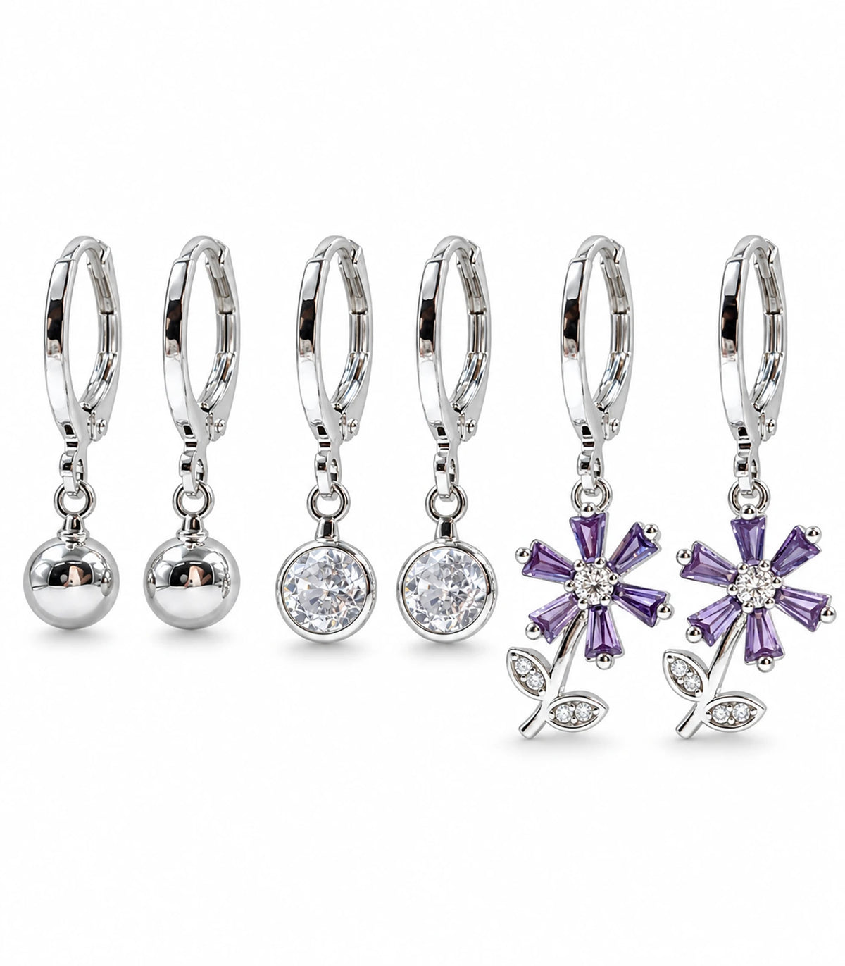 Complete silver-tone three-pair hoop earring set with ball, clear crystal and purple flower charms; six earrings