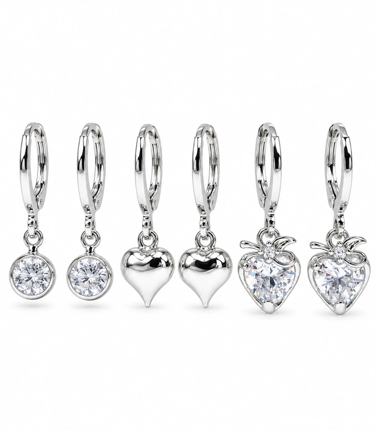 Complete silver-tone three-pair hoop earring set with round clear crystals, smooth hearts and bow-topped crystal hearts