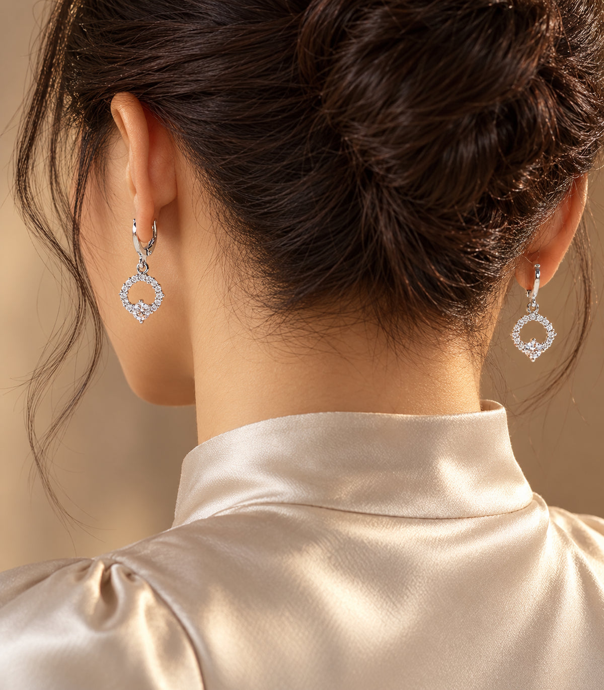Editorial worn view of a pair from the silver-tone geometric crystal hoop earring set