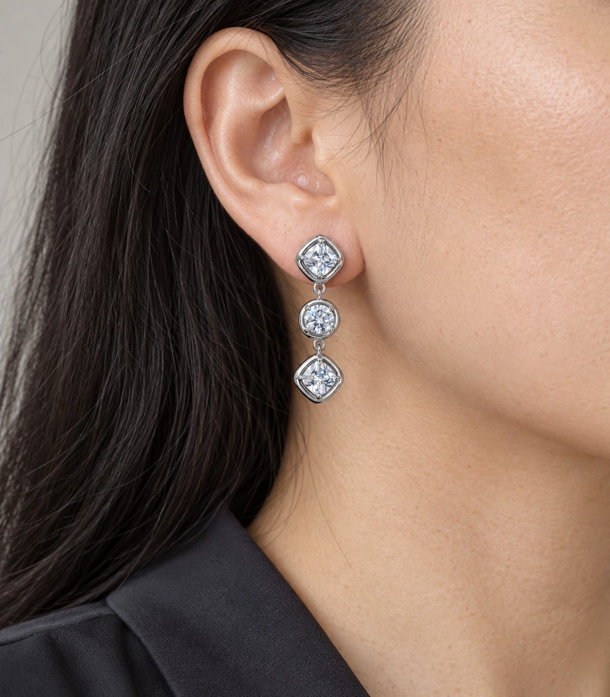 JIMIKI Three Stone Crystal Drop Earring Pair in Silver tone, close-up detail #color_silver tone