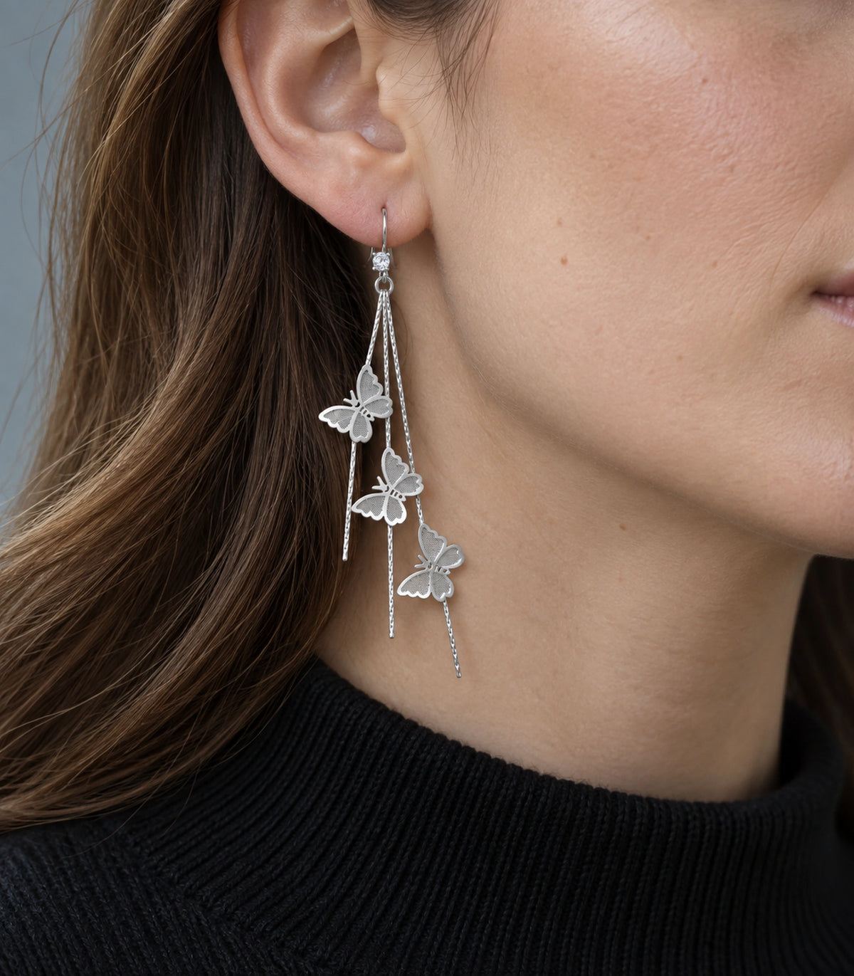 JIMIKI Silver-Tone Triple Butterfly Chain Drop Earrings in Silver Tone, model wearing view