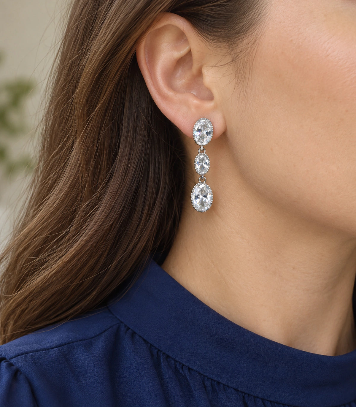 JIMIKI Triple Oval Crystal Drop Earrings in Silver tone, model wearing view #color_silver tone