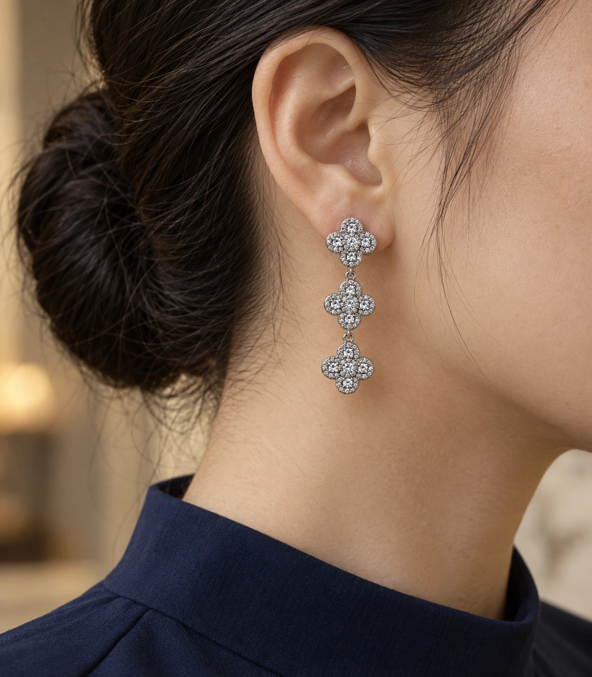 JIMIKI Pave Triple Quatrefoil Drop Earring Pair in Silver tone, editorial model view #color_silver tone