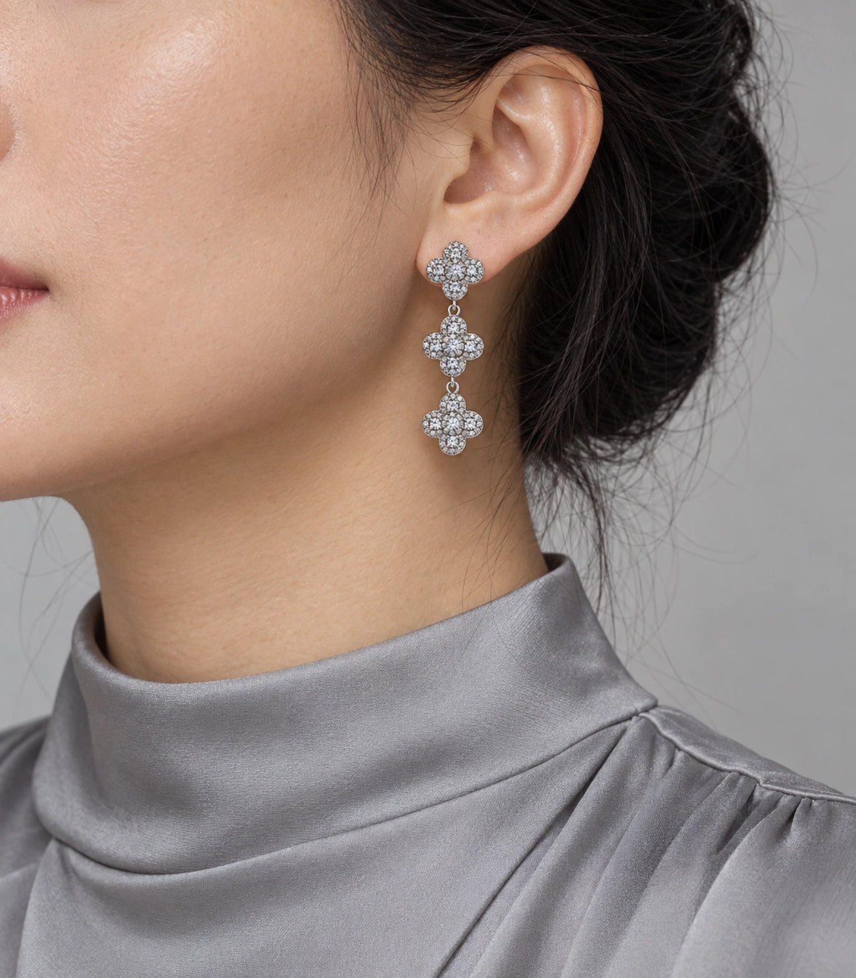 JIMIKI Pave Triple Quatrefoil Drop Earring Pair in Silver tone, model wearing view #color_silver tone