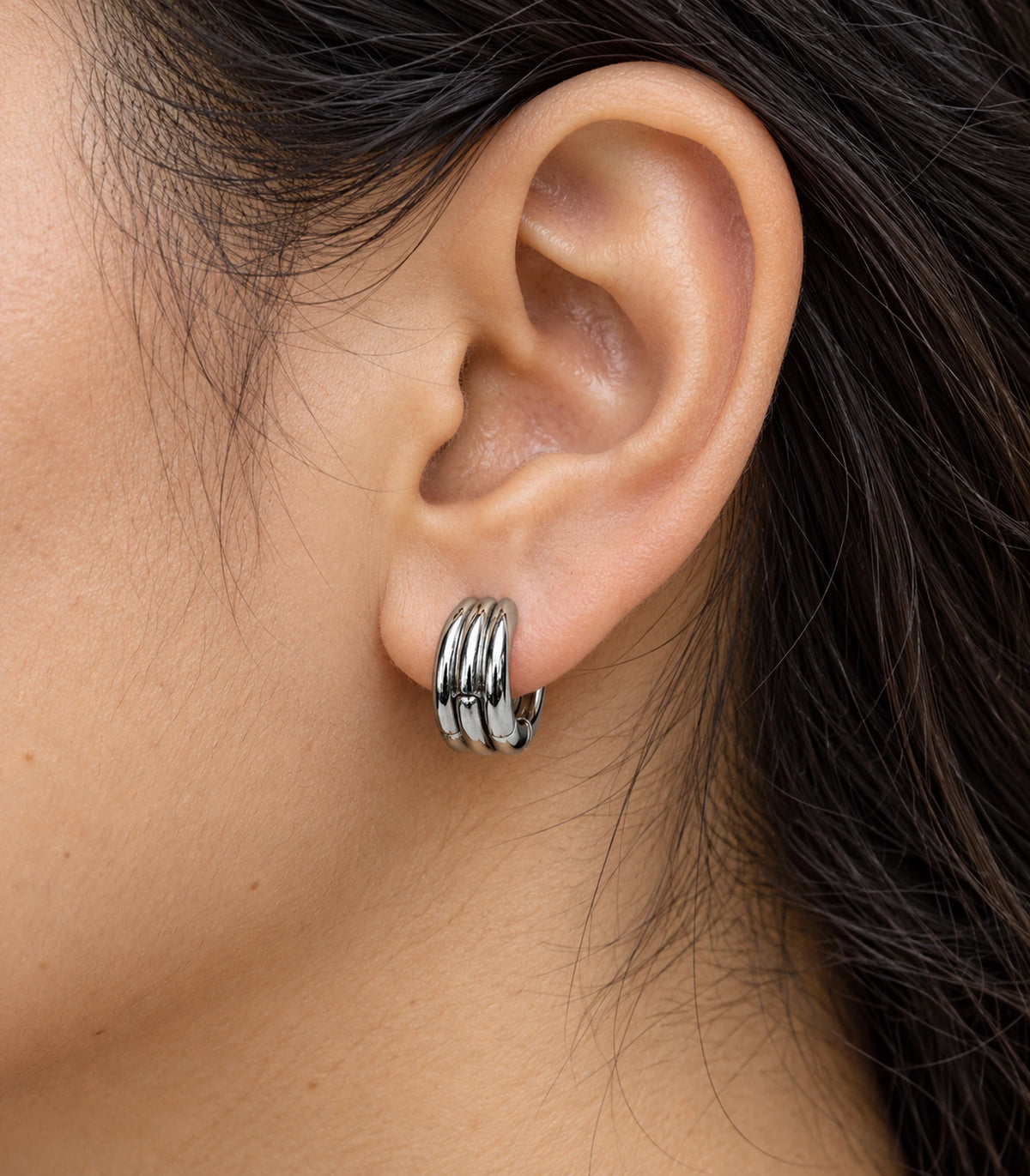 JIMIKI Triple-Ridge Huggie Hoop Earrings in Silver - closeup #color_silver