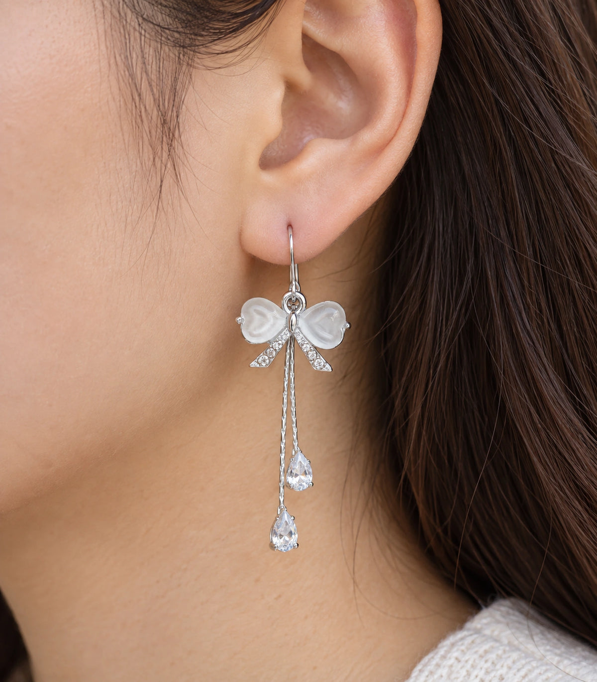 JIMIKI Silver Tone White Bow Twin Pear Chain Earring Pair in Silver-tone, close-up detail