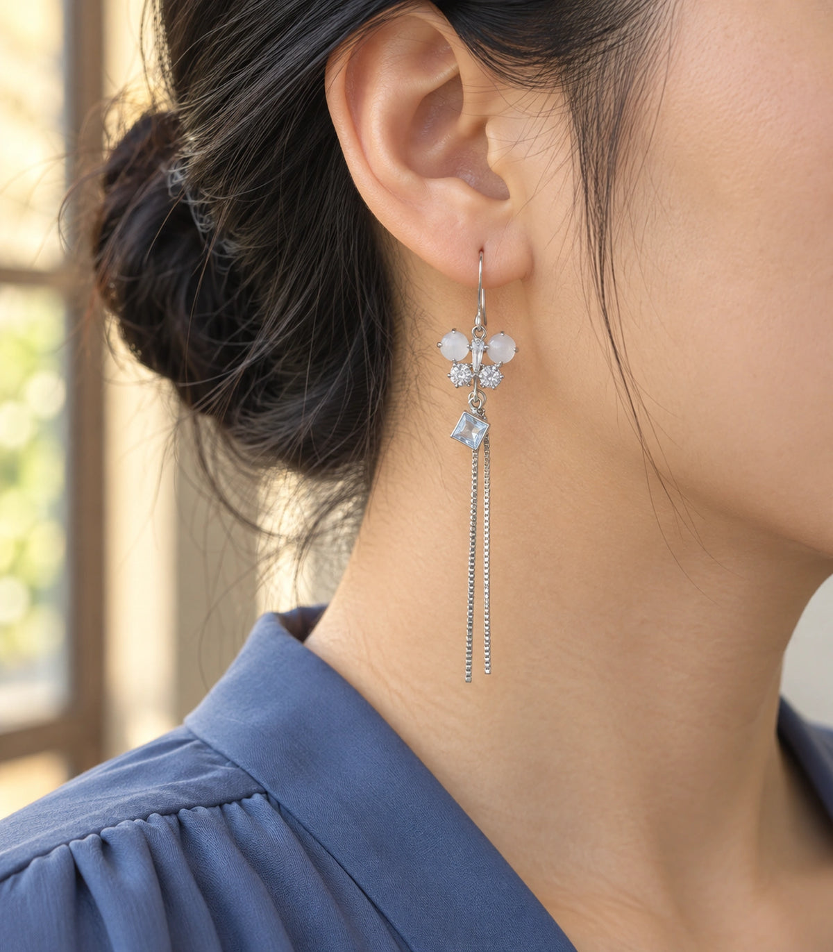 JIMIKI Silver Tone White Butterfly Square Chain Tassel Earring Pair in Silver-tone, editorial model view