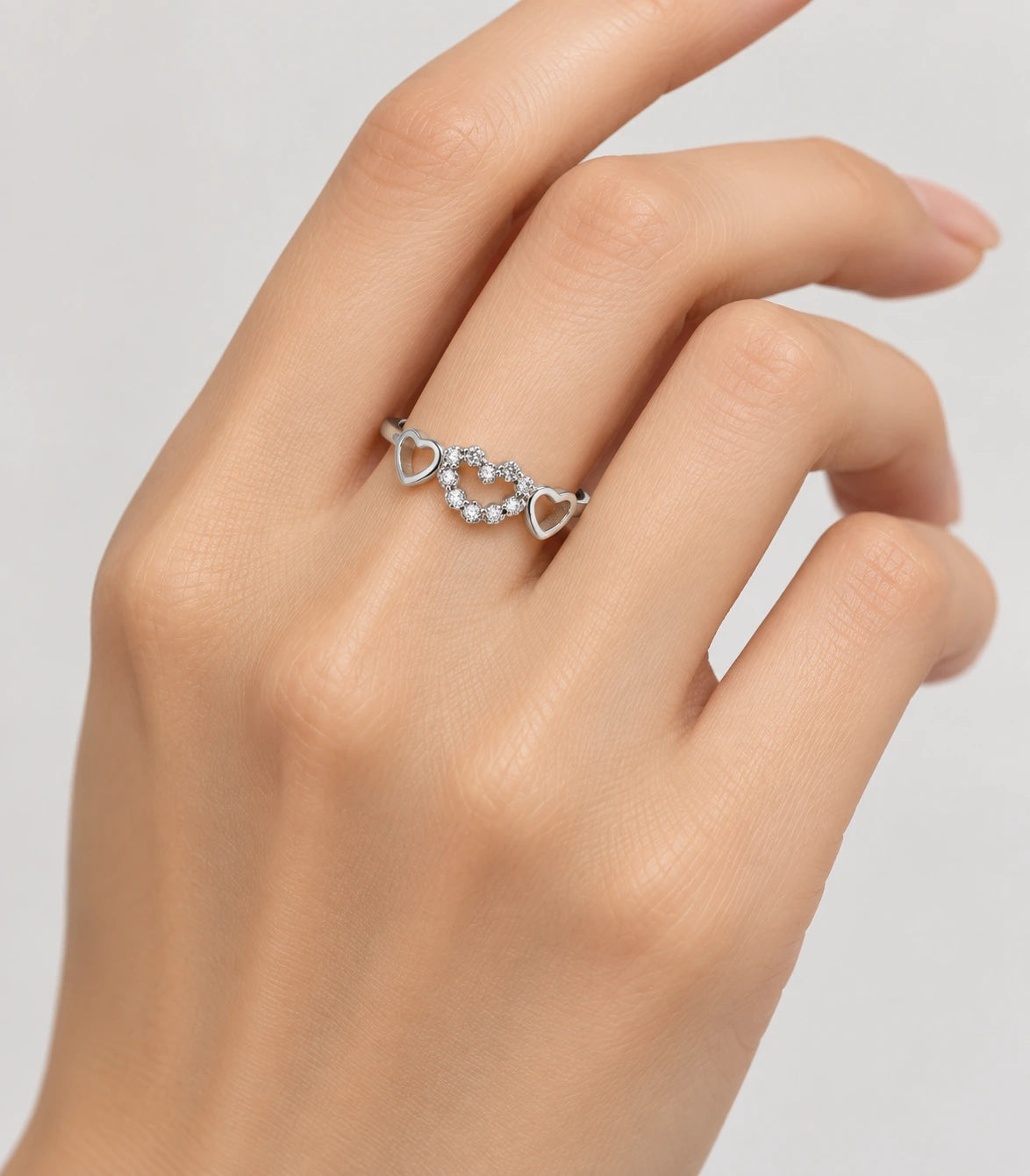JIMIKI Triple Heart Crystal Adjustable Ring in Silver - worn styling view #color_silver
