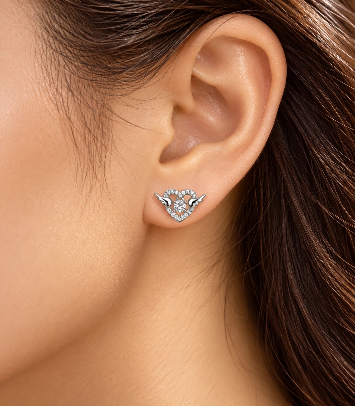 JIMIKI Winged Heart Crystal Stud Earrings in Silver — editorial worn styling #color_silver