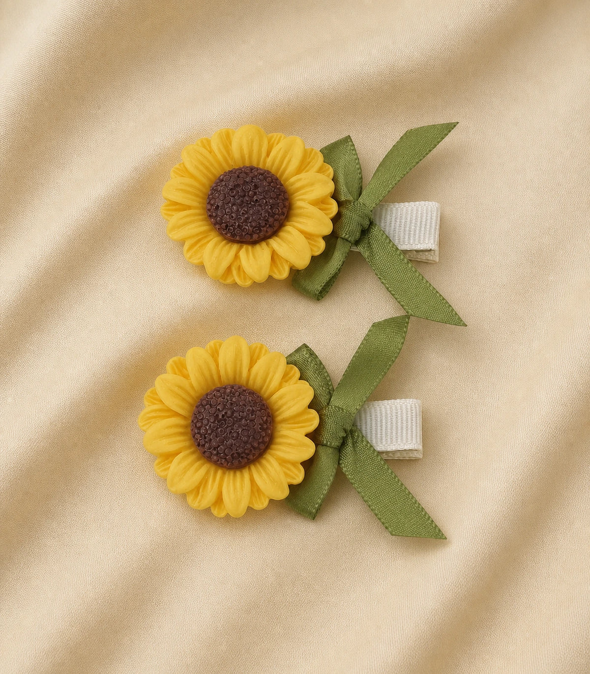 Editorial flat lay of the Sunflower Olive Ribbon Clip Pair
