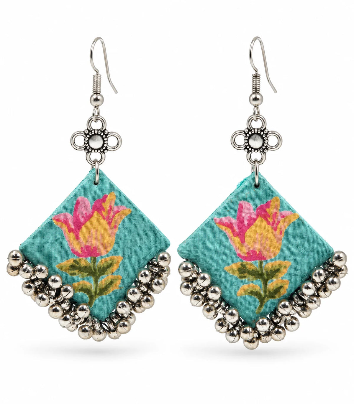 Complete pair of turquoise floral fabric ghungroo earrings on white