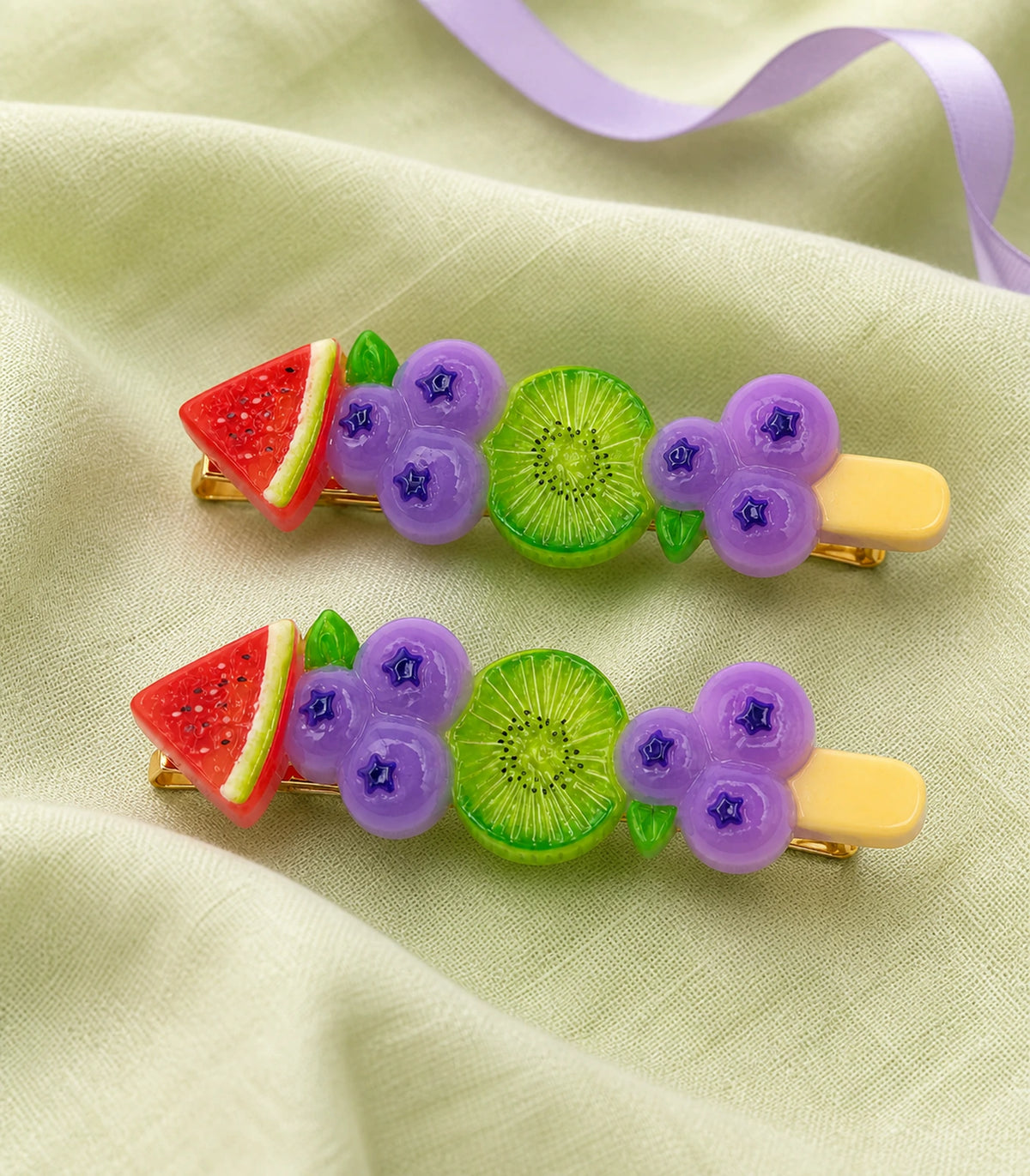 Editorial flat lay of the Watermelon Blueberry Kiwi Barrette Pair
