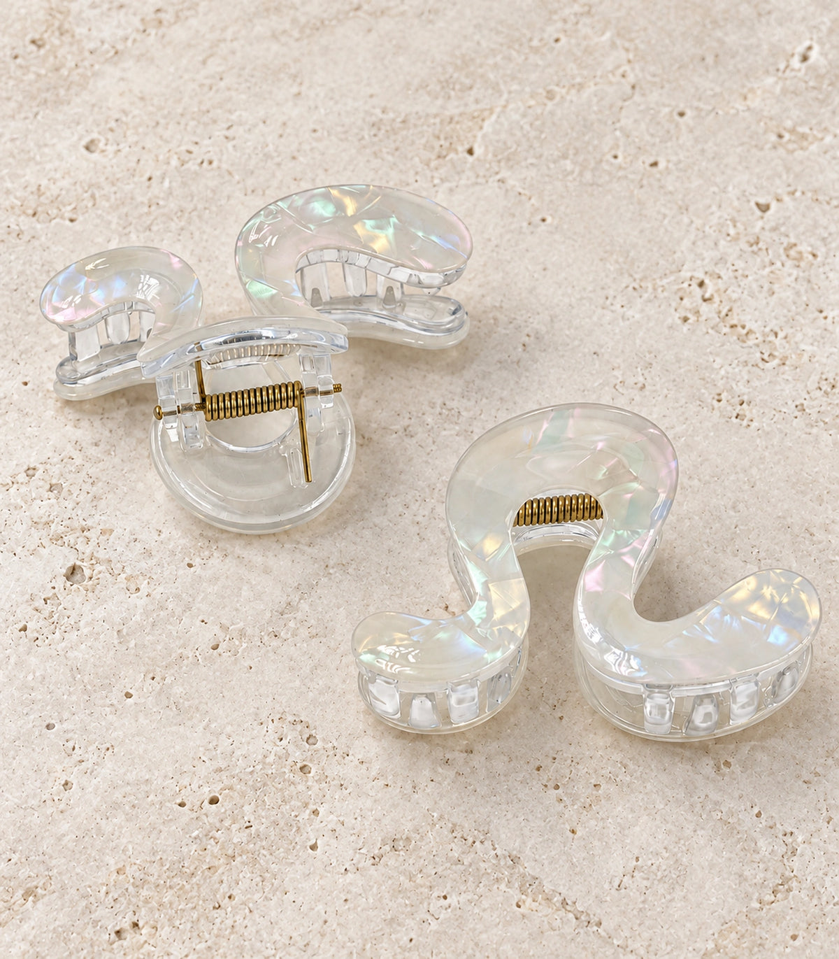 JIMIKI Iridescent S Shaped Hair Claw Clips in White, editorial flat lay #color_white