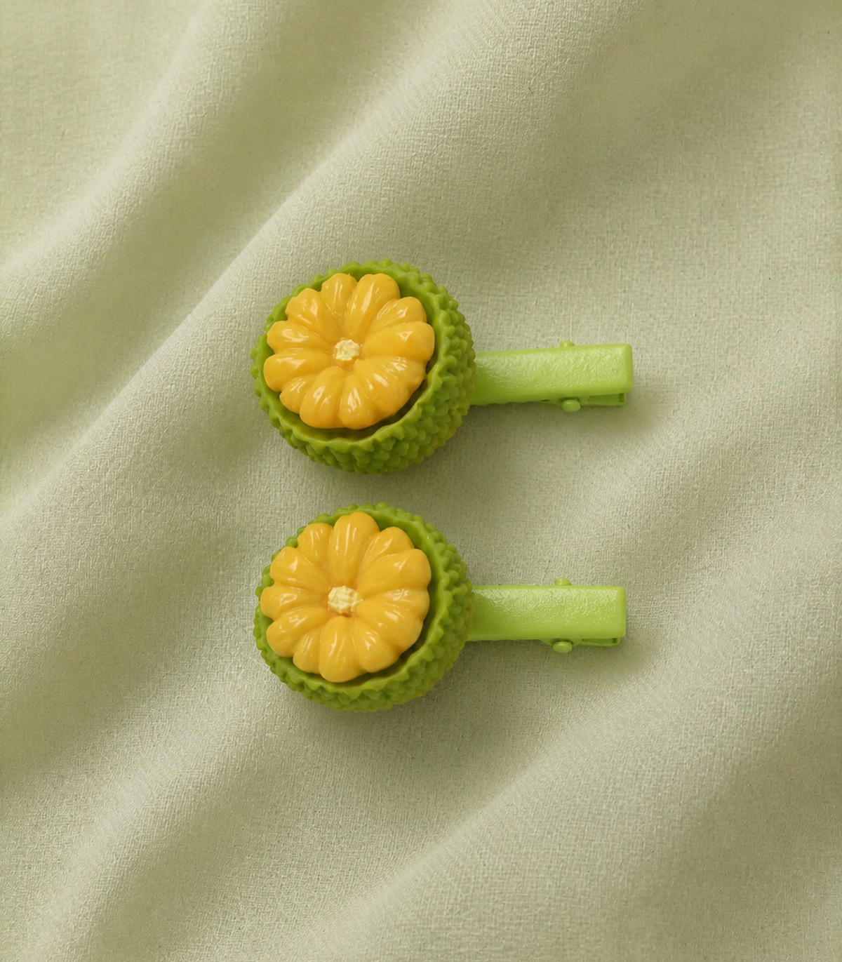 Yellow Flower Fruit Barrette Pair editorial flat lay
