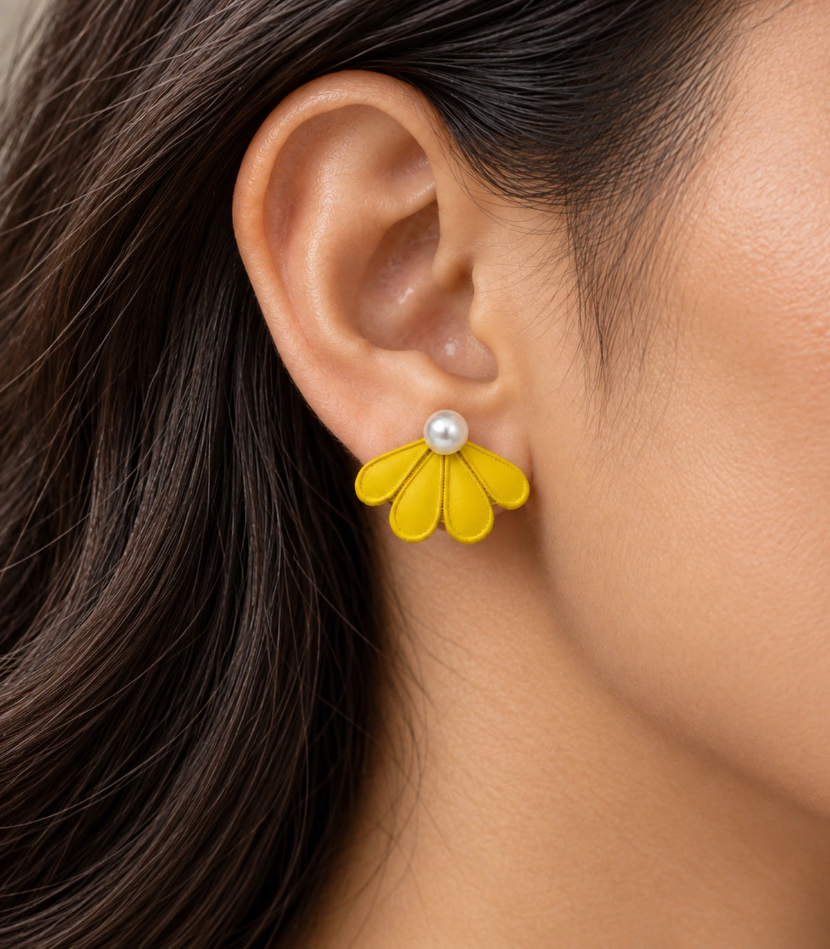 JIMIKI Yellow pearl fan petal stud earrings, worn closeup of four petals and pearl-style bead #color_yellow