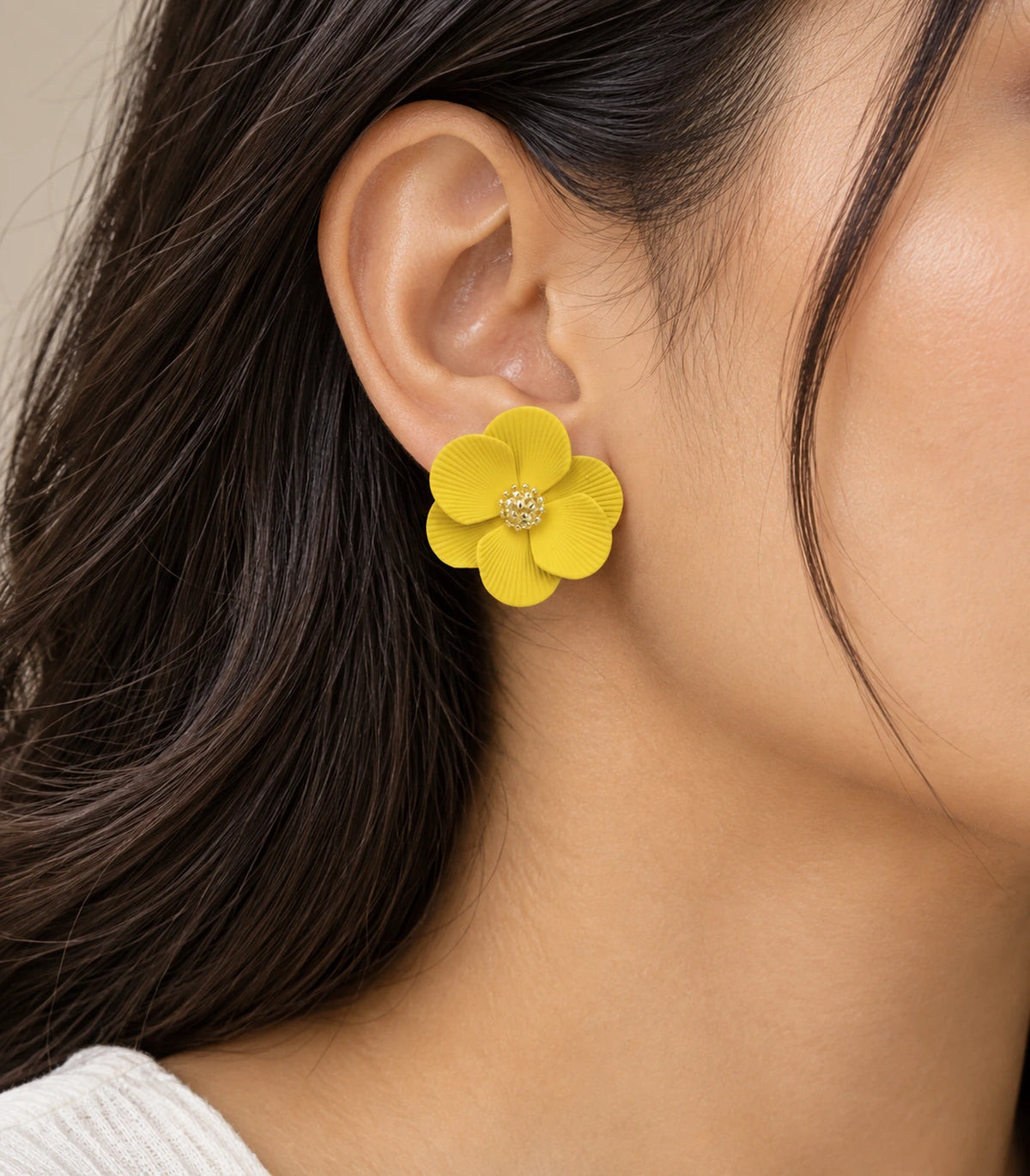 JIMIKI Yellow ribbed flower stud earrings, worn view showing the flower stud #color_yellow
