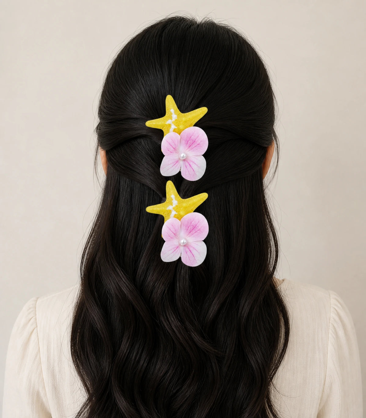 Model wearing the Yellow Starfish Pink Flower Clip Pair