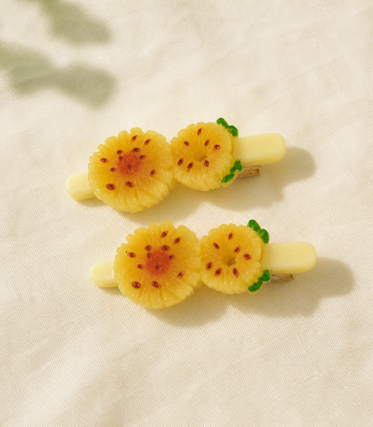 Yellow Tropical Flower Duo Clip Pair in an editorial flat lay